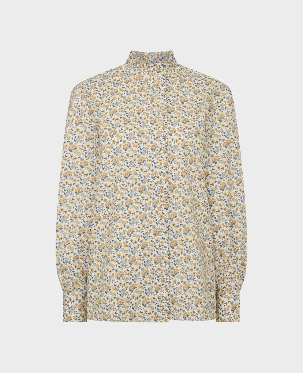 With its romantic deep frill and pretty patterns, this Liberty print floral blouse captures the essence of two iconic heritage brands that transcend time with effortless grace and style. Pair it with tailored denim for a chic off-duty look that you'll wear on repeat.